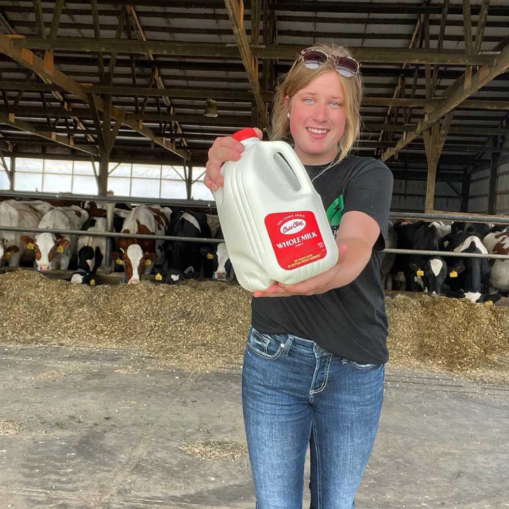 Dairy Farmers of America - Farmer Holding Milk